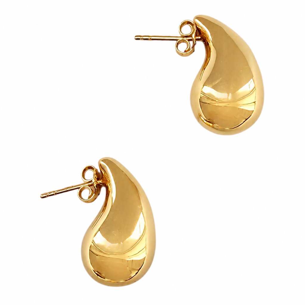 Side view of 14K gold teardrop earrings on a white background