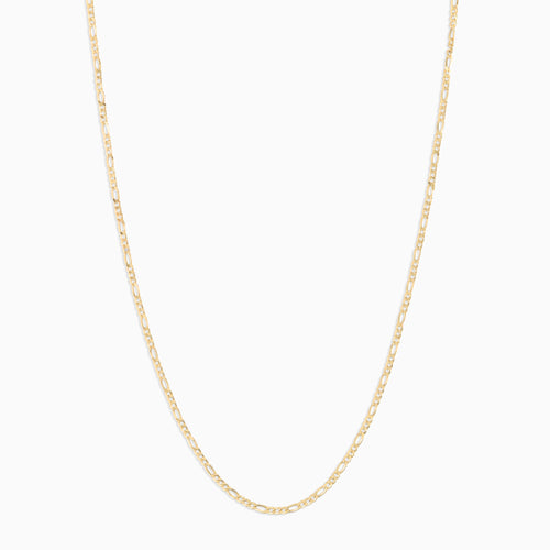 senoe 10K yellow gold figaro chain necklace on a white background
