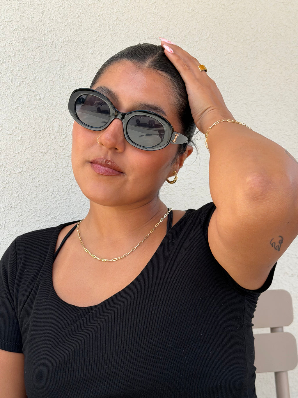 senoe 10k yellow gold paperclip link bracelet worn with a matching gold necklace 