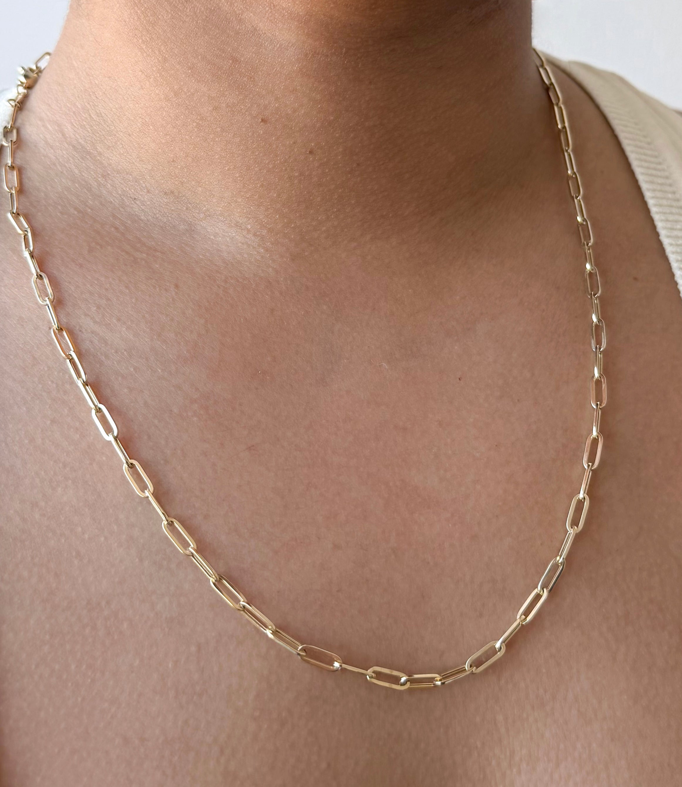 senoe 10k yellow gold paperclip chain necklace worn around the neck