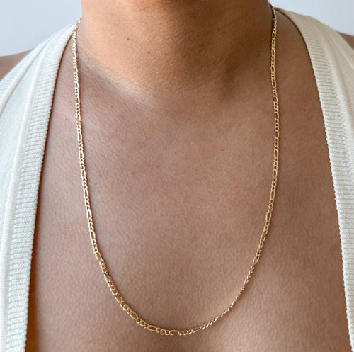 senoe 10K yellow gold Figaro chain necklace worn around the neck
