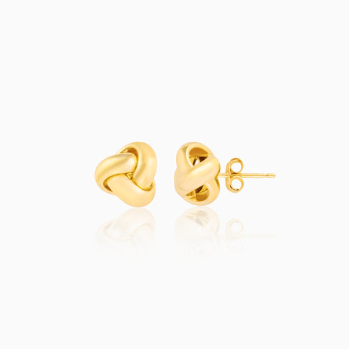 senoe gold knot stud earrings in 14k yellow gold on a white background
