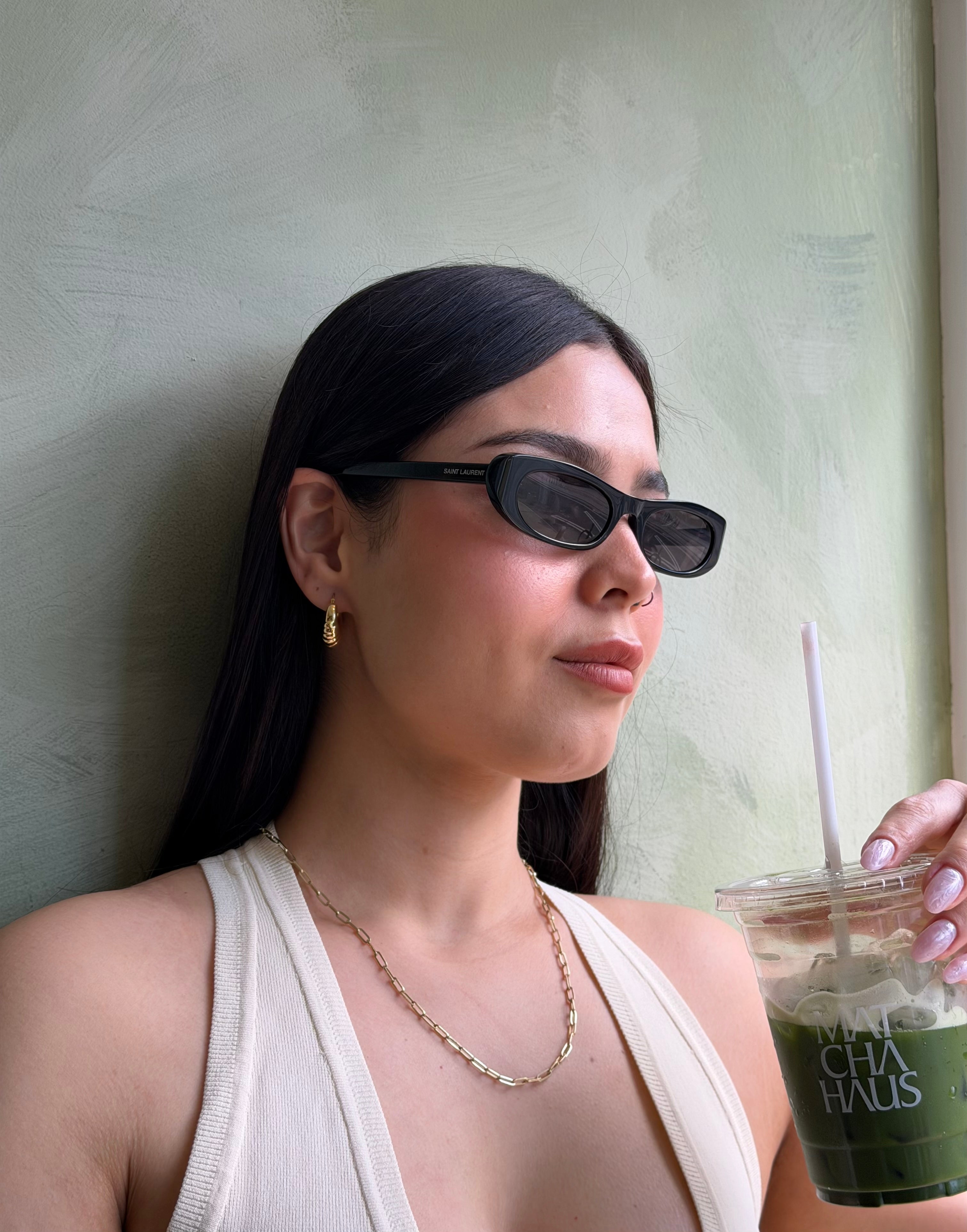 model wearing senoe ribbed hoop earrings in 14k yellow gold 